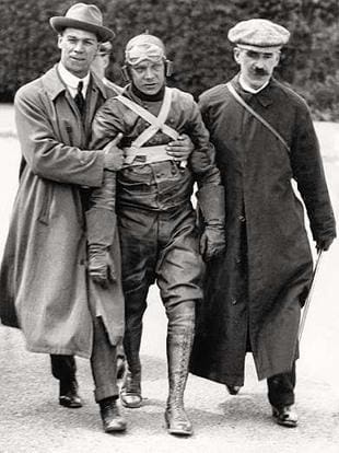 Winner of the 1913 Junior TT, NUT founder High Mason is helped along after his iwnning ride