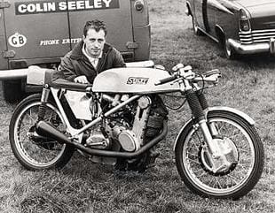 Colin Seeley poses behind his 150cc AJS 7R powered Seeley at Mallory Park in 1968
