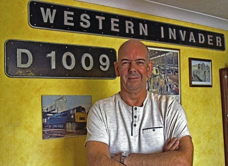 Class 52 fan, Neil Carter, with the Western Invader nameplate and D1009 cabside numberplate, which he has reunited after 40 years. SCOTT LEWIS