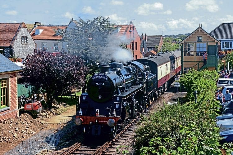 BR Standard 4MT 2-6-0 No. 76084 brings up the rear of the North Norfolk Railway’s first dining train to Cromer as it departs from Sheringham on its first main line run in preservation on August 10. BRIAN SHARPE