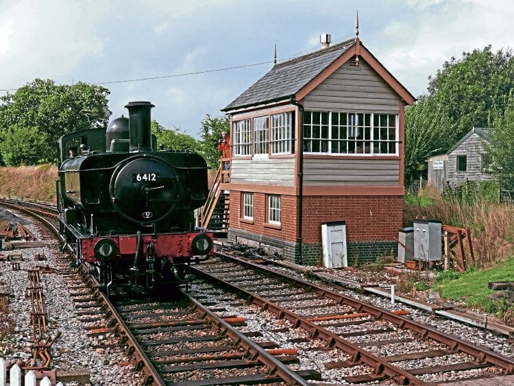 GWR 0-6-0PT No. 6412 passes the new Ashburton Junction signalbox as it runs round its train on August 21. 