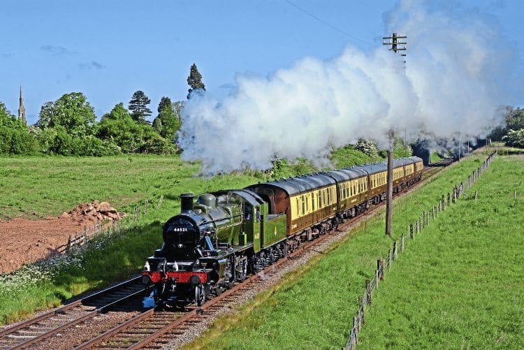 LMS Ivatt 2-6-0 No. 46521 in BR lined green livery, passes Woodthorpe Lane on the Great Central Railway. BRIAN SHARPE 