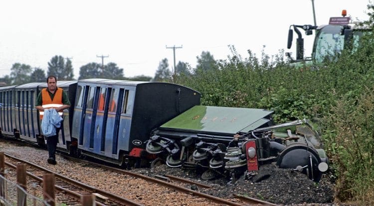 No. 1 Green Goddess lying on its side at the head of the derailed train on September 10. It will now have to be dismantled to assess the extent of the damage. THE LOOKER