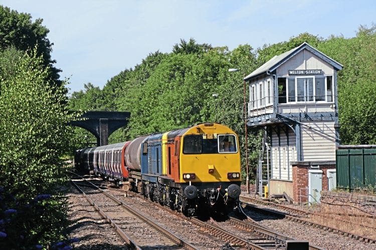 Harry Needle Railroad Co. Class 20 No. 20314 leads a convoy of London Underground tube stock into Melton Mowbray on August 24 en route from Old Dalby to Amersam. BRIAN SHARPE
