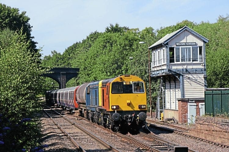 Harry Needle Railroad Co. Class 20 No. 20314 leads a convoy of London Underground tube stock into Melton Mowbray on August 24 en route from Old Dalby to Amersam. BRIAN SHARPE 