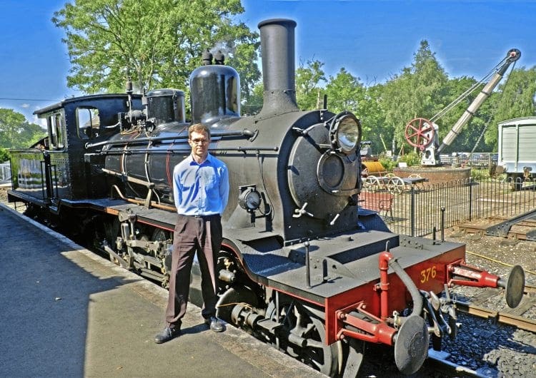 Catering for the future: André Freeman, who has been appointed commercial manager at the Kent & Sussex Railway after 14 years as catering manager, in the company of 2-6-0 No. 376 Norwegian at Tenterden station. ALAN CROTTY