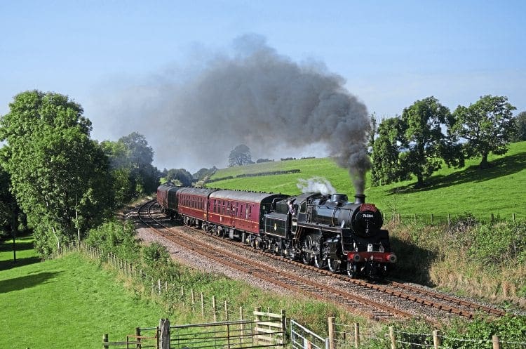 BR Standard 4MT 4-6-0 No. 76084 passes Starrick’s Farm on its main line proving run from Carnforth round the Hellifield - Blackburn circuit on September 20. DAVID PRICE 