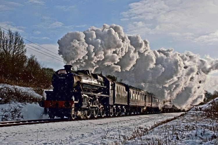 LMS ‘Black Five’ No. 44871 powers through a snow shower with an East Lancashire Railway Santa special. ELR