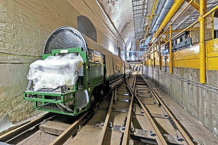 Train of thought: One of the new trains in the Mail Rail depot at Mount Pleasant near King’s Cross after its delivery at the end of October. Visitors to London will be able to ride through the former Post Office Underground Railway tunnels thanks to a major project that also includes an exhibition centre and new museum. MILES WILLIS/POSTAL MUSEUM & MAIL RAIL