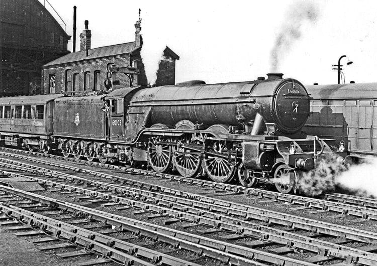 London-bound: LNER A3 No. 60103 Flying Scotsman waits for the right away with the 2.10pm from Manchester London Road to Marylebone on February 28, 1953. The shot is a favourite of photographer Brian Green, who recorded the scene when working at the station during a 29-year railway career. BKB GREEN/NORMAN PREEDY ARCHIVE 