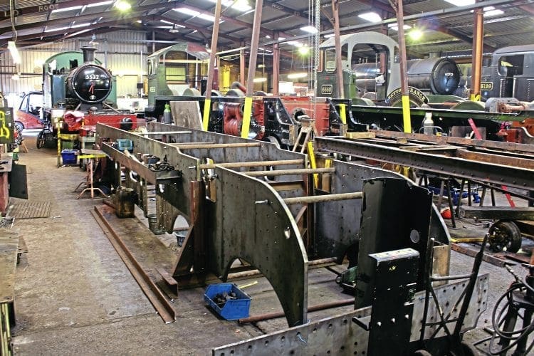 The frames of new-build LNER Sandringham 4-6-0 No. 61660 Spirit of Sandringham. In the background are GWR 2-6-2T Nos. 5532 and 5199, new-builds Betton Grange and The Unknown Warrior, and LNER D49 4-4-0 No. 62712 Morayshire. QUENTIN MCGUINESS