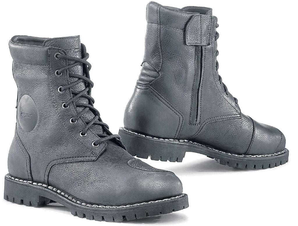 A pair of black biker boots on a white background.