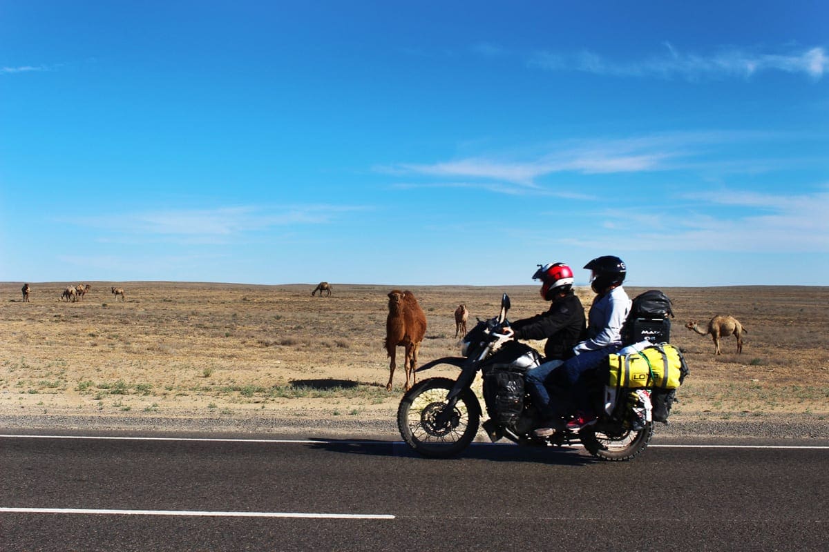Photo of the pair motorcycling across the country