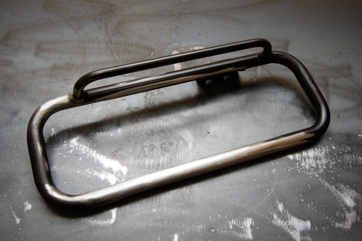 The standard XSR luggage rack seems over-fussy, so I cut and welded them to from one, much neater version.