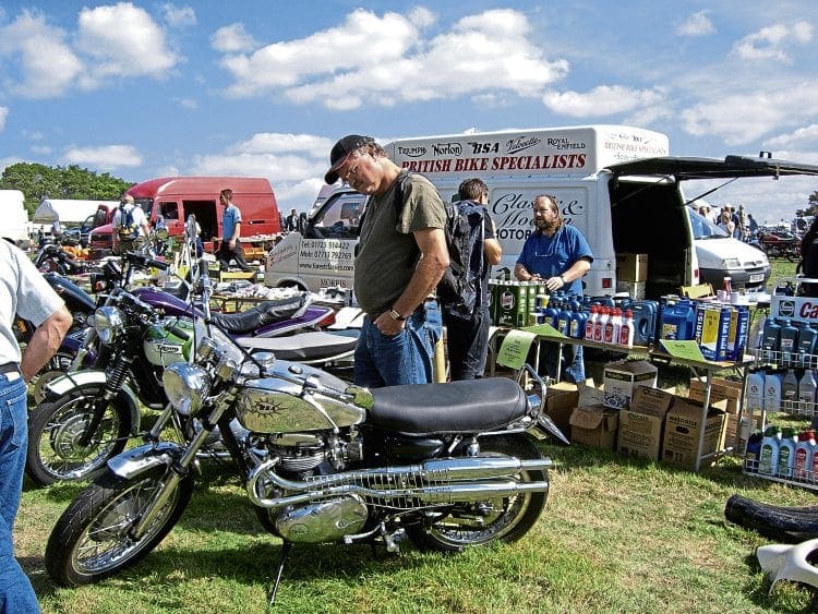 Netley Marsh Eurojumble visitors inspect some of the classic bikes for sale.