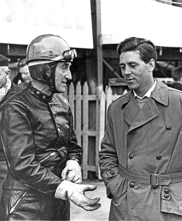 Stanley Woods and Geoff Duke having a chat at the TT in 1957