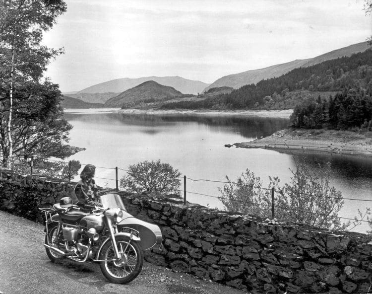 Lake District scene: Great Hawe, the mound to the left of the picture, and the far bank are reflected on the smooth surface of the picturesque Lake Thirlmere