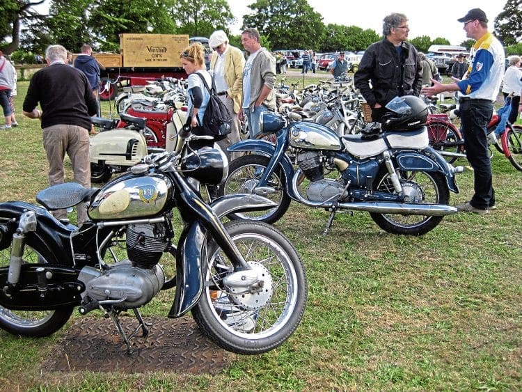 The amazing build quality of NSU motorcycles is more than evident in this photo taken at a typical British gathering – and just look at those Prima scooters as well.