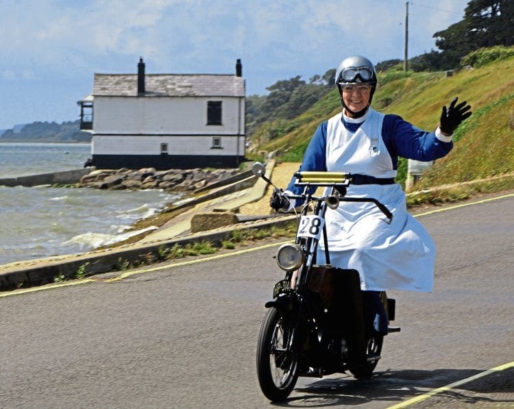 There’s a sunny smile from best lady rider Jane Jarvis (1923 Kenilworth) as the sea breeze catches her immaculate period nurse’s costume.