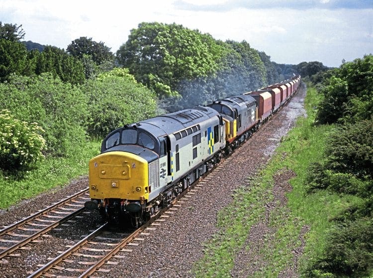 The early 1990s saw a pair of Class 37s rostered to the Washwood Heath stone job, as illustrated by Nos. 37686 and 37676 in charge on June 29, 1991. The pair are seen heading the empty wagons north through Duffield, Derbyshire, as an additional 6Z15/13.30 Washwood Heath to Peak Forest RMC. No. 37686 was withdrawn in 2000 and scrapped in 2006, but No. 37676 survives in store with West Coast Railways at Carnforth. Phil Chilton