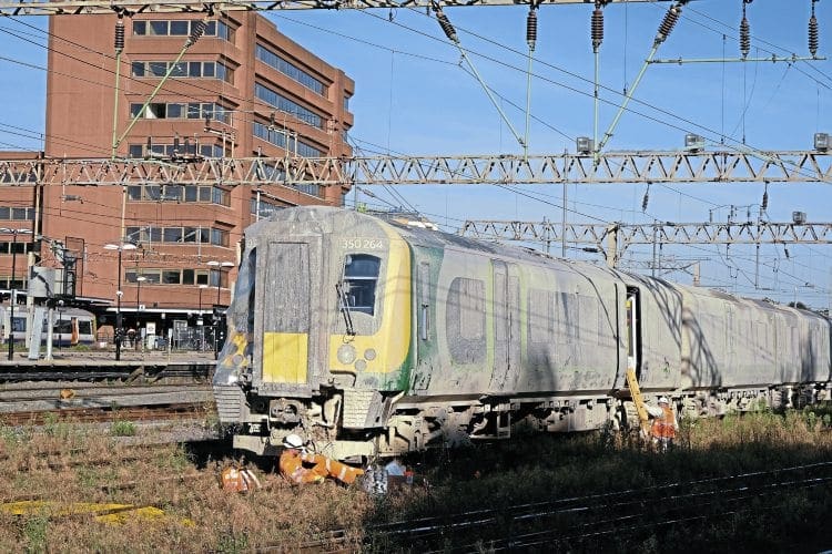 Its future uncertain, ‘Desiro’ No. 350264 is pictured on September 23, after being moved to Watford station. This was the leading unit that was derailed in the nearby incident and then struck by classmate No. 350233. Note how the unit is covered in a layer of mud, while the right-hand side of the cab is wrapped in plastic. Mark Lawrence 