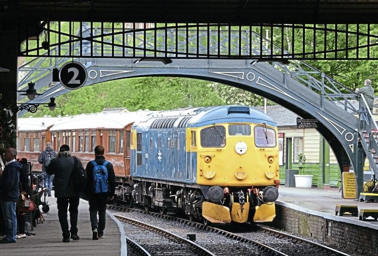 Snowplough-fitted ‘MacRat’ No. 26038 arrives under the trainshed roof at Pickering on June 17 with a service from Grosmont formed of ex-LNER teak coaches. Paul Bickerdyke 