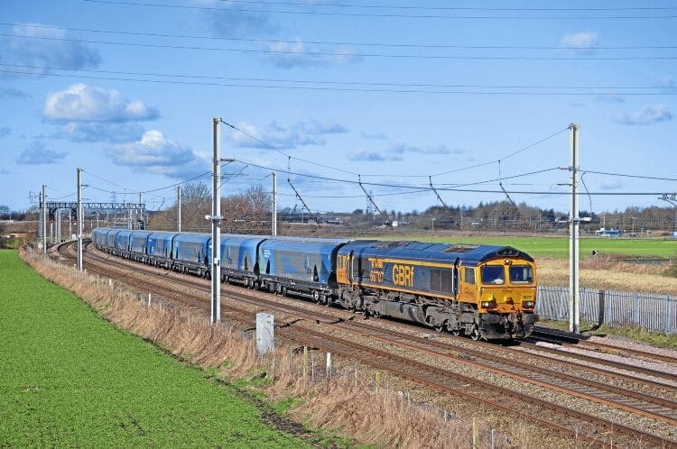 Working out of Liverpool Biomass Terminal, GBRf Type 5 No. 66707 Sir Sam Fay passes Old Alder Lane bridge, Winwick, on February 23, on its way to Drax. DOUG BIRMINGHAM