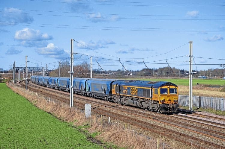 Working out of Liverpool Biomass Terminal, GBRf Type 5 No. 66707 Sir Sam Fay passes Old Alder Lane bridge, Winwick, on February 23, on its way to Drax. DOUG BIRMINGHAM