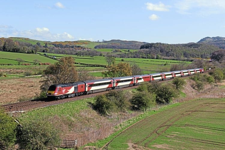 On April 26, a Virgin Trains East Coast set, led by power car No. 43206, climbs to Dalgety summit, just west of Aberdour, with the 07.52 Aberdeen-King’s Cross train. IAN LOTHIAN (INSET): The nameplate of Class 91 No. 91101.
