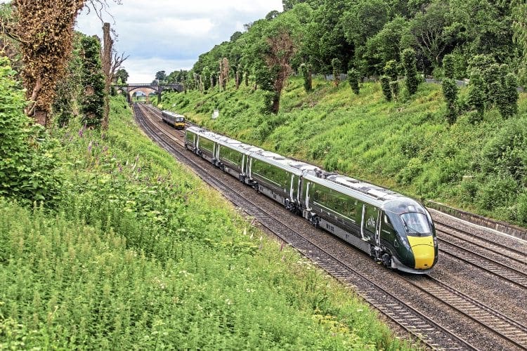 Hitachi IEP No. 800004 in GW green livery works 1Z17 13.42 Reading-London Paddington through Sonning Cutting on its first run carrying passengers on June 30. Note the lack of catenary at this location, although progress is being made in other places. KEN BRUNT 