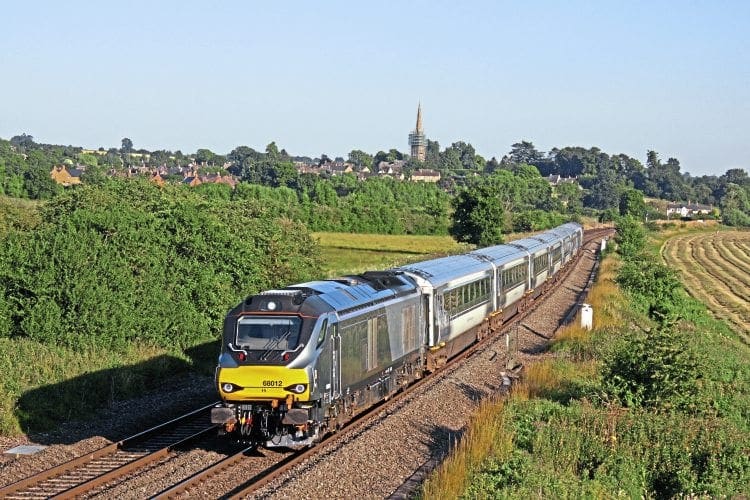 Chiltern Class 68 No. 68012, with DVT No. 82309 at the rear, passes Kings Sutton, near Banbury, during the evening of July 19 with the 17.21 London Marylebone-Banbury service. PAUL BIGGS