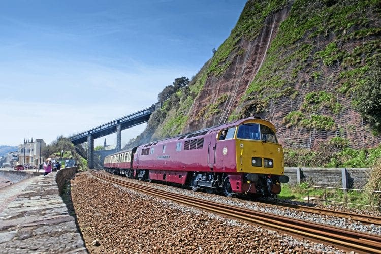 In a classic scene reminiscent of the 1960s and 70s, Class 52 No. D1015 masquerades as No. D1010 Western Campaigner heading a Pathfinder Tours charter past Teignmouth on May 7. FRASER PITHIE 