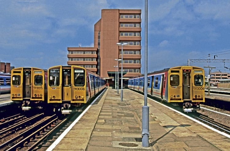 Showing two differing front-end styles, Network SoutEast Class 313 Nos. 313015, 313006 and 313005 stand at Watford Junction on July 18, 1988, displaying Croxley Green and Euston in the destination panels. BRIAN MORRISON 