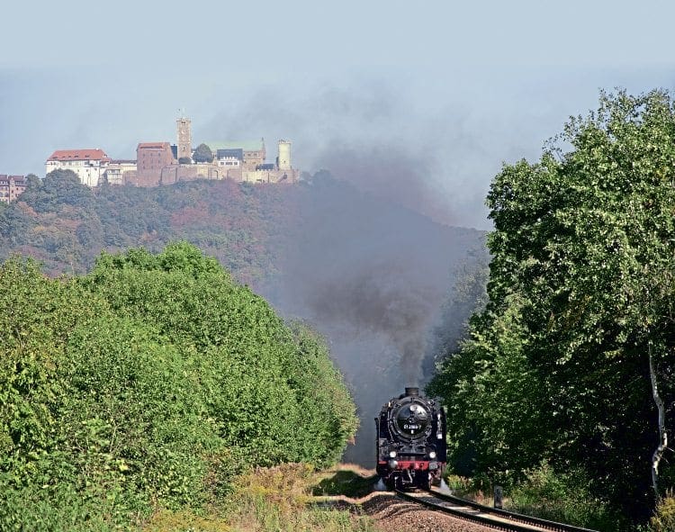 ‘01’ Pacific No. 01 2066-7 completes the scene between Eisenach and Förtha, heading south on the 1-in-40 climb, overlooked by the historic Wartburg castle on September 15. The Wartburg was where Martin Luther translated the Hebrew and Greek bible into German. 