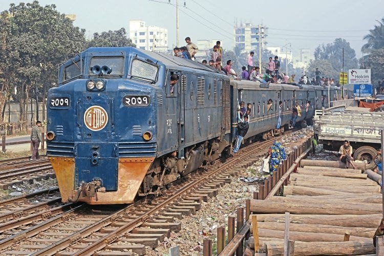 Arriving at Dhaka Biman Bandar station with train 33 Up from Chittagong on December 14, 2013 is No. 2037. The GM was taken off its container train at Akhaura to replace a failed locomotive half its age. Note the dual-gauge track, which is common around the capital Dhaka. Although the loco number looks like 2009, the numerals are in Bengali, so appear like symbols. ALL PICTURES BY THE AUTHOR. 