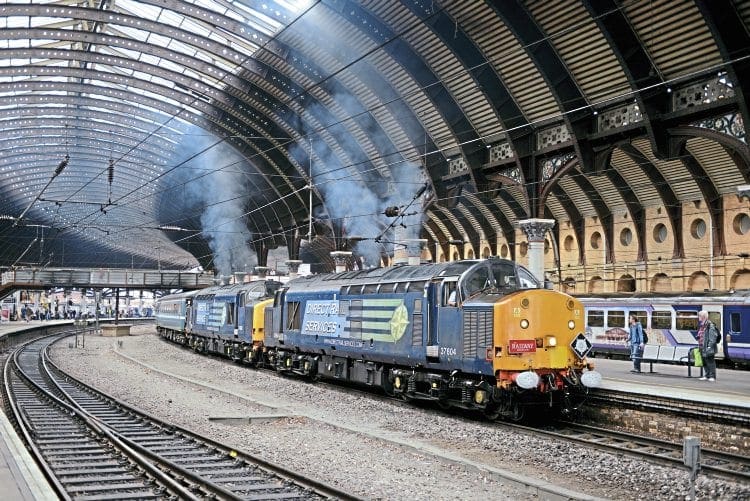 The DRS Type 3 pairing of Nos. 37604 and 37603 make a smoky exit from York towards Scarborough with the 'Independent Yorkshireman' tour on September 3. RON COVER