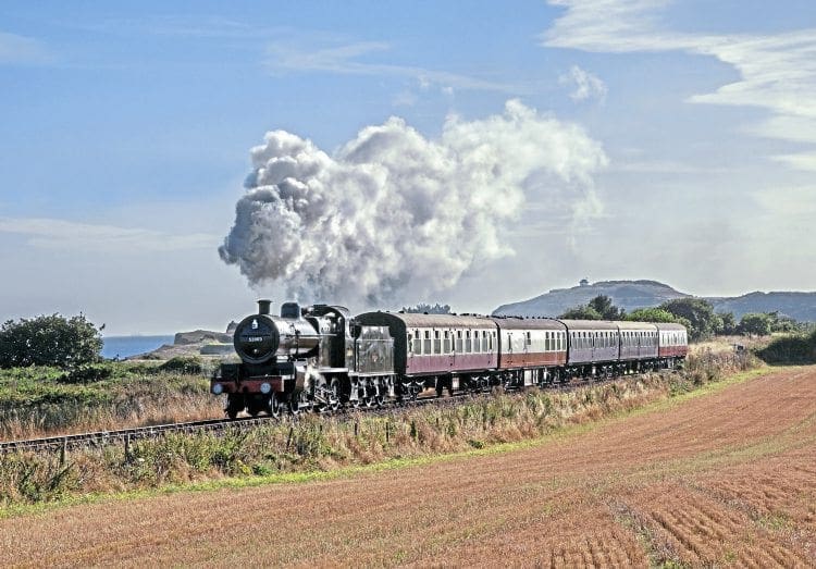 Bright, late-summer sunshine illuminates ‘7F’ No. 53809 as it passes Sheringham golf course on September 3. ROBERT FALCONER