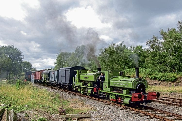 With a combined age of 207 years, Andrew Barclay 0-4-0STs Colin McAndrew and Rosyth No. 1 enter Chasewater Heaths station with a mixed freight from Brownhills West on September 4. ALISTAIR GRIEVE 