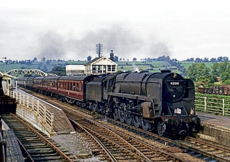 BR Standard ‘9F’ 2-10-0 No. 92001 passes Shepton Mallet at the head of a Bradford to Bournemouth through train on September 1, 1962. DAVE COBBE/RAIL PHOTOPRINTS