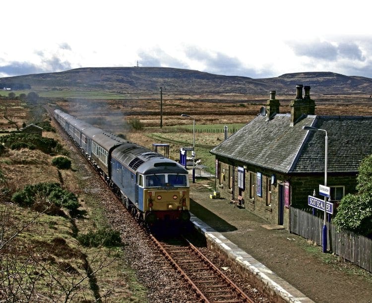 With a backdrop of a remote Caithness landscape, Class 47 No. 47712 Artemis passing Scotscalder with the 07.30 Inverness-Thurso 'Blue Pullman' special on April 16, 2006. GRAEME ELGAR