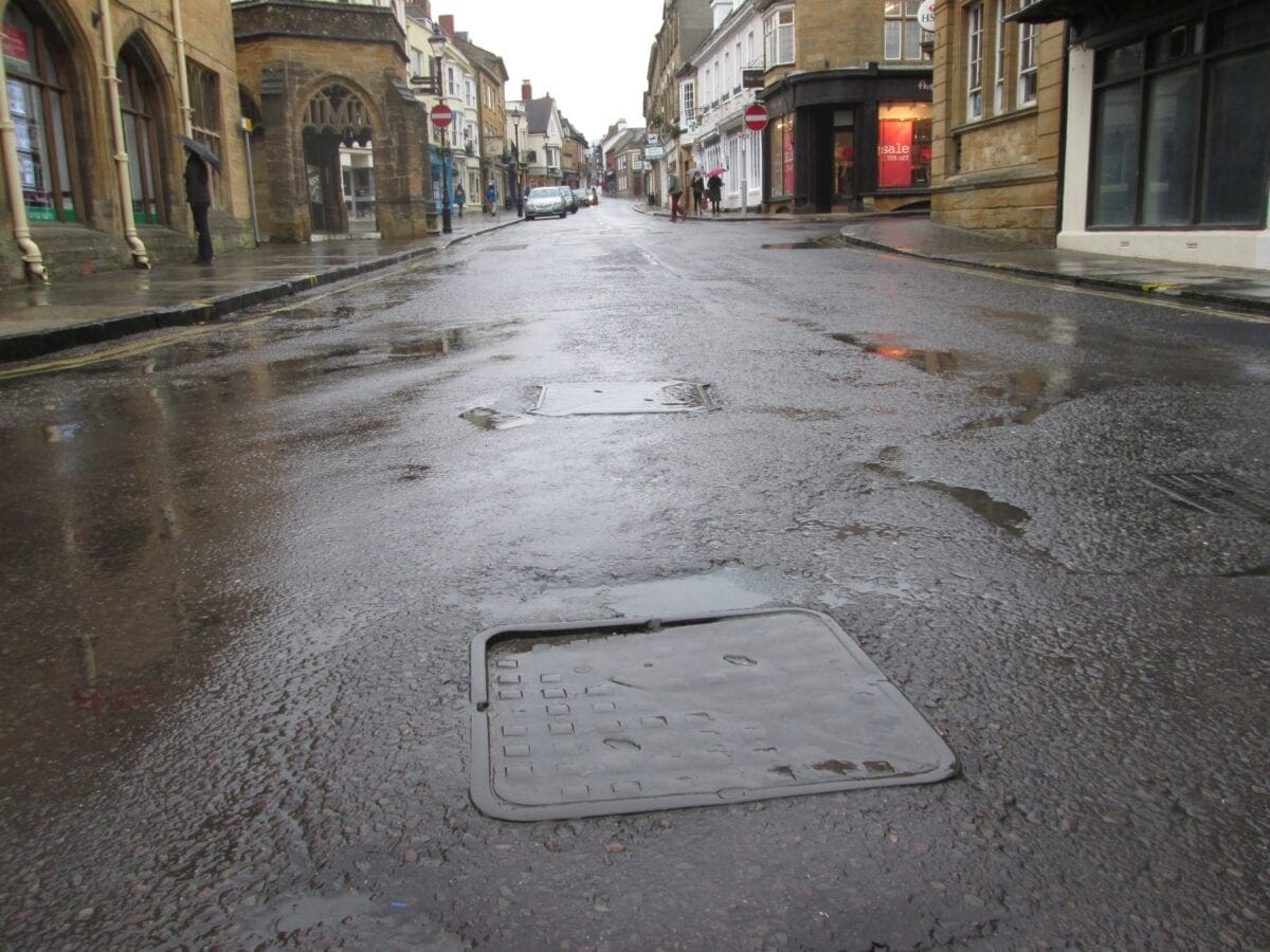 Wet manhole covers are slippy; worn smooth wet manhole covers are super-slippy