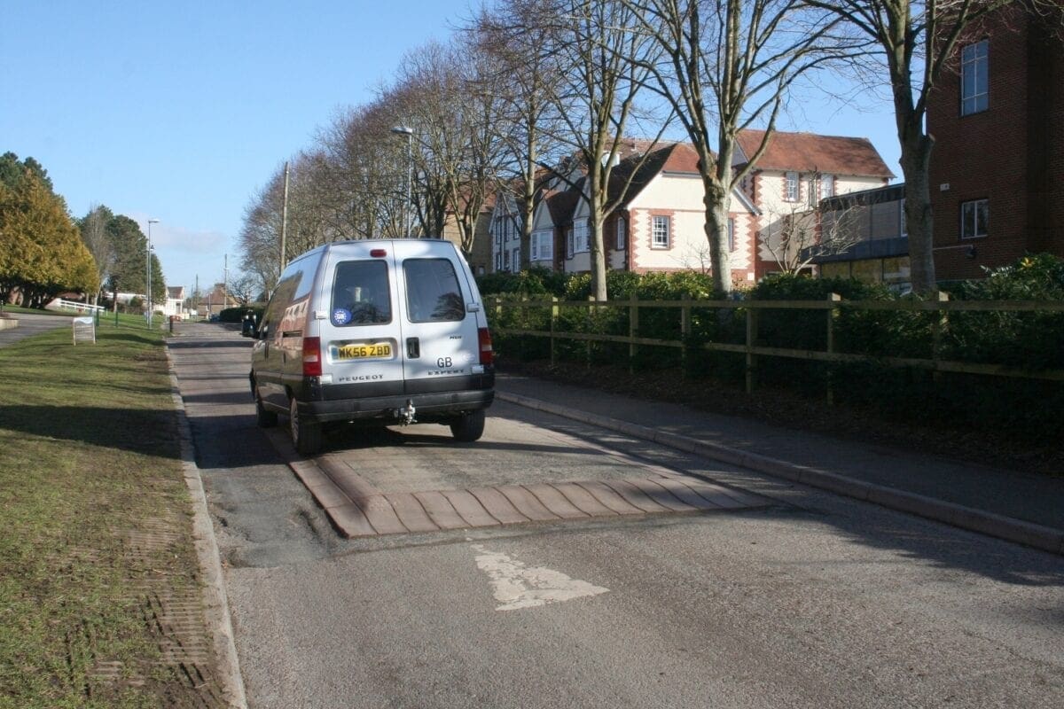 The van lumbers over the hump, but we can nip round the inside