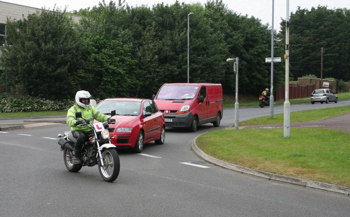 Taking left-hand lane before his exit also prevents Mr red car from shooting up the outside