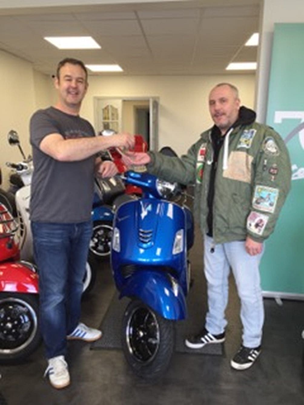 Mark 'Maca' McDonald taking delivery of his new Vespa from Sean Nash of Moto Continental, Birmingham